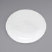 A white oval porcelain bowl with a small rim.