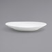 A white Front of the House Ellipse oval porcelain plate on a gray background.