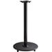 A black Lancaster Table & Seating cast iron bar height table base on wheels.