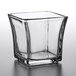 An Anchor Hocking square glass container.