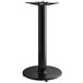 A black metal Lancaster Table & Seating bar height table base with a metal stand.