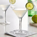 An Anchor Hocking martini glass with a lime wedge on the rim.