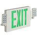 A white rectangular Lavex exit sign with green lit up text.