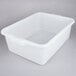 A white plastic Vollrath Traex food storage box with a raised lid.