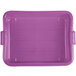 A purple plastic Vollrath Traex bus tub with handles.