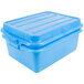 A Vollrath blue plastic food storage container with a lid.