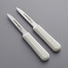 Two Dexter-Russell Sani-Safe paring knives with white handles.