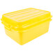 A yellow Vollrath Traex food storage container with raised snap-on lid.