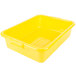 A yellow Vollrath Traex food storage container with a raised snap-on lid.