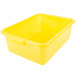 A yellow plastic Vollrath Traex food storage container with a lid.