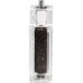 A glass Chef Specialties pepper mill filled with black pepper.