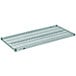 A close-up of a green Metro Super Erecta wire shelf with black handles.