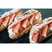 A Sasa Demarle Flexipan Eclair Mold with three strawberry desserts.