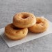 A stack of Rich's yeast-risen donuts on a napkin.