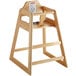 A Lancaster Table & Seating wooden high chair with a natural finish.