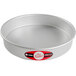 A round silver Fat Daddio's cake pan with a red and white label.