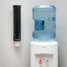 A San Jamar black wall mount water cup dispenser with a black tube.