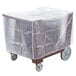 A Cambro dark brown dish caddy with a plastic covered box on a wheeled cart.