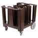 A brown plastic Cambro dish cart with wheels and a brown vinyl cover.