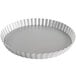 A round silver Fat Daddio's fluted tart/quiche pan with a removable bottom.