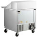 A Beverage-Air stainless steel refrigerated sandwich prep table with wheels.