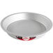 A round silver Fat Daddio's anodized aluminum pie pan with a red and black label.