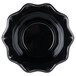 A black bowl with a scalloped edge.