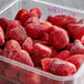 A plastic container of whole strawberries with a label that says "Whole Strawberries" on a white background.