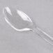 A clear plastic WNA Comet tasting spoon.