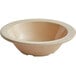 An Acopa Foundations tan melamine bowl with a white rim.