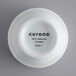 A white porcelain ramekin with black text that says "Corona by GET Enterprises"