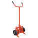 A red Wesco hand truck for steel drums with black wheels.