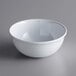 A white Acopa Foundations melamine bowl on a gray surface.