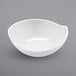 A white bowl with a curved surface.