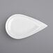 A white plate with a teardrop shaped design.