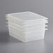 A stack of three Cambro translucent plastic food pans with seal covers.