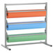 A Bulman metal paper rack with three rolls of paper on it with a serrated blade.