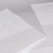 A white plastic sheet with a cut out edge.