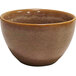 A brown Venus bouillon cup with white spots on the brown surface.