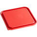 A red square Vigor food storage container lid on a tray.