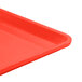 A close up of a red Cambro dietary tray.