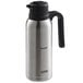 A Thermos stainless steel vacuum insulated carafe with a lid in cream.