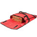 A red American Metalcraft insulated pizza delivery bag holding two pizza boxes.
