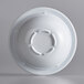 A white melamine bowl with a circular design on a white background.