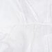 A close-up of a white Cordova microporous coverall with a white background.