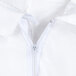 A close-up of a zipper on a white coverall.