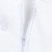 A close up of a zipper on a white coverall.