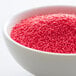 A bowl of pink nonpareils.