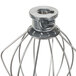 A KitchenAid wire whip with a metal handle.