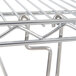 A metal rack for wire shelving with a tray slide.